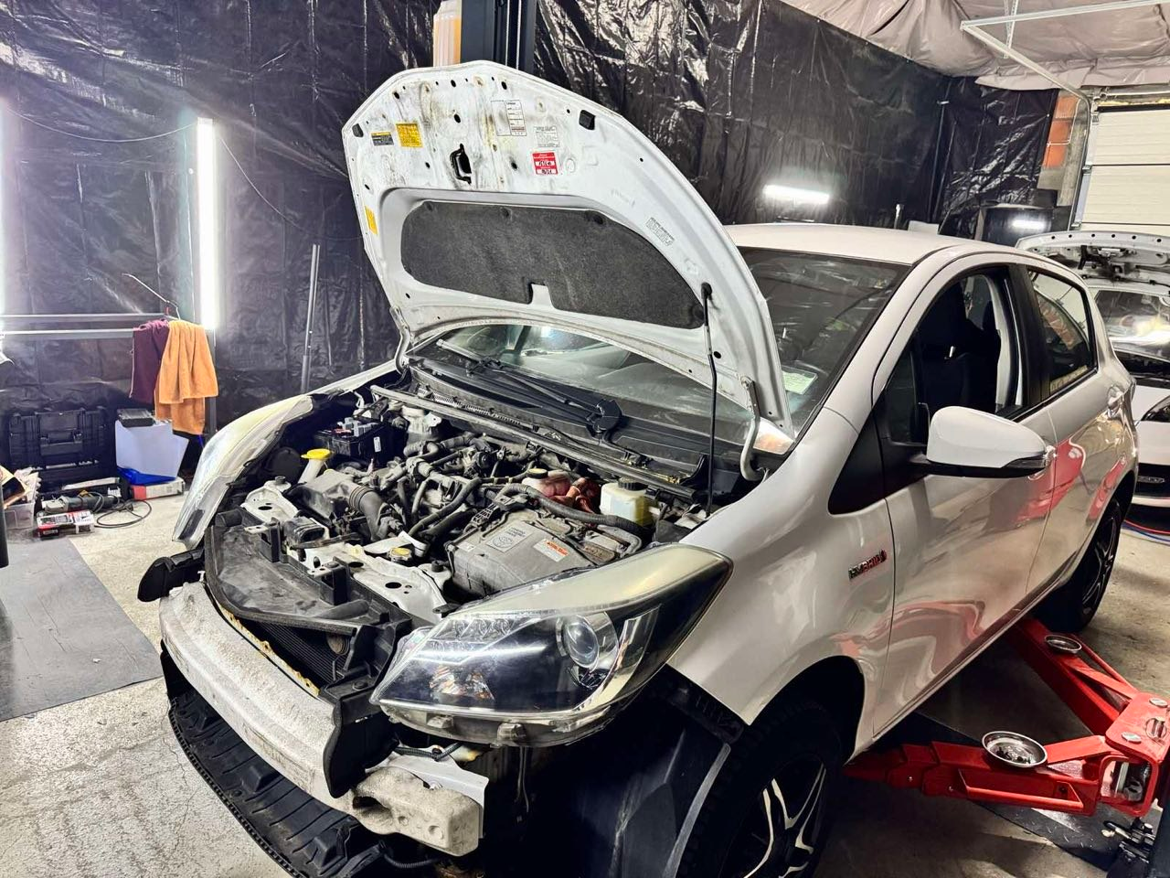 Engine bay repair on a workshop lift